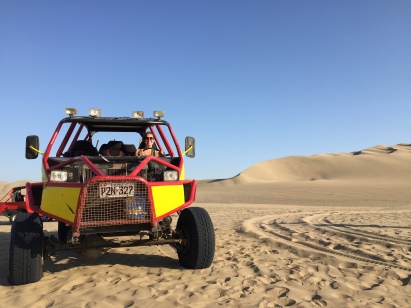 Buggy driving in desert near Huacachina