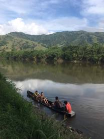 Crossing the Cauca river by boat